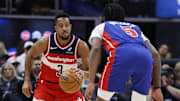 Nov 10, 2025; Detroit, Michigan, USA;  Washington Wizards guard CJ McCollum (3) dribbles defended by Detroit Pistons forward Ronald Holland II (5) in the first half at Little Caesars Arena. Mandatory Credit: Rick Osentoski-Imagn Images