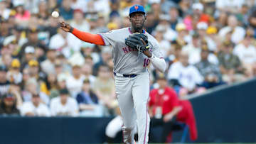 Jul 29, 2025; San Diego, California, USA; New York Mets third baseman Ronny Mauricio (10) makes the throw to first base for an out during the second inning against the San Diego Padres at Petco Park. Mandatory Credit: David Frerker-Imagn Images