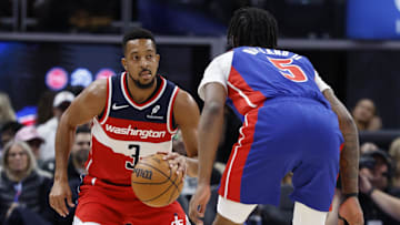 Nov 10, 2025; Detroit, Michigan, USA;  Washington Wizards guard CJ McCollum (3) dribbles defended by Detroit Pistons forward Ronald Holland II (5) in the first half at Little Caesars Arena. Mandatory Credit: Rick Osentoski-Imagn Images
