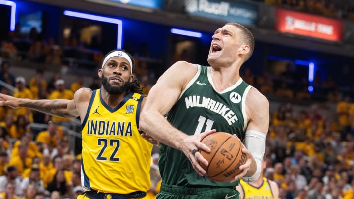 May 2, 2024; Indianapolis, Indiana, USA; Milwaukee Bucks center Brook Lopez (11) shoots the ball while Indiana Pacers forward Isaiah Jackson (22) defends during game six of the first round for the 2024 NBA playoffs at Gainbridge Fieldhouse. Mandatory Credit: Trevor Ruszkowski-USA TODAY Sports