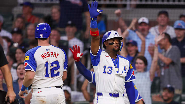 Atlanta Braves catcher Sean Murphy celebrates with MLB star Ronald Acuna Jr. after scoring against the New York Yankees