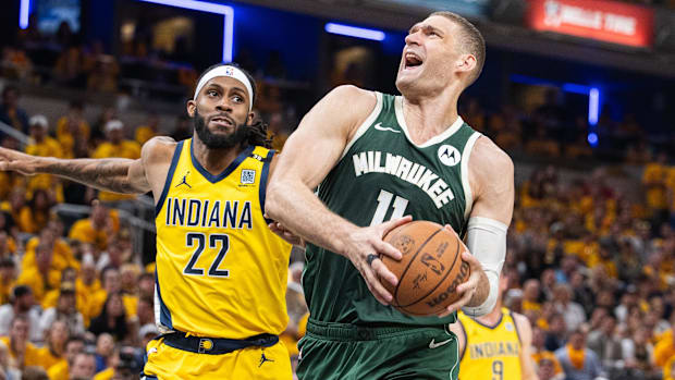 Milwaukee Bucks center Brook Lopez shoots while Indiana Pacers forward Isaiah Jackson defends during the 2024 NBA playoffs.