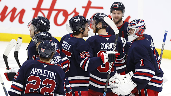 Oct 20, 2024; Winnipeg, Manitoba, CAN; Winnipeg Jets celebrate their victory over the Pittsburgh Penguins at Canada Life Centre. Mandatory Credit: James Carey Lauder-Imagn Images