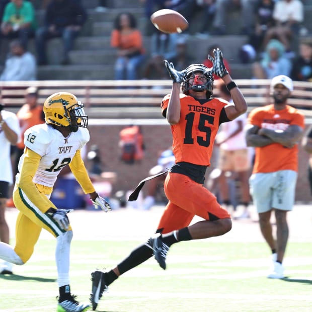 Withrow wide receiver Chris Henry Jr. (15) catches a touchdown pass in front of Taft's Quinton Price (12) during the Tigers' 