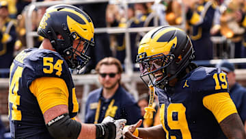 Michigan quarterback Bryce Underwood (19) celebrates a touchdown against Central Michigan with offensive lineman Andrew Sprague (54) during the second half at Michigan Stadium in Ann Arbor on Saturday, Sept. 13, 2025.