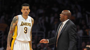 Apr 1, 2012; Los Angeles, CA, USA; Los Angeles Lakers coach Mike Brown (right) talks with forward Matt Barnes (9) during the game against the Golden State Warriors at the Staples Center. The Lakers defeated the Warriors 112-120. Mandatory Credit: Kirby Lee/Image of Sport-Imagn Images