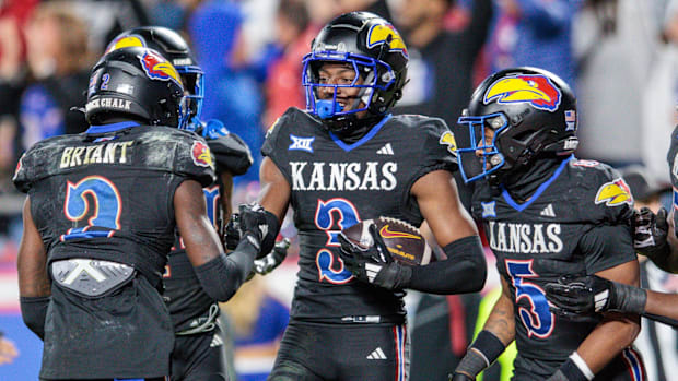 Kansas players celebrate after scoring a touchdown against Iowa Stae