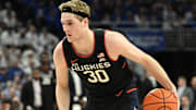 Feb 11, 2025; Omaha, Nebraska, USA;  Connecticut Huskies forward Liam McNeeley (30) dribbles against the Creighton Bluejays during the first half at CHI Health Center Omaha. Mandatory Credit: Steven Branscombe-Imagn Images