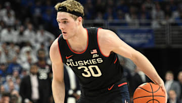 Feb 11, 2025; Omaha, Nebraska, USA;  Connecticut Huskies forward Liam McNeeley (30) dribbles against the Creighton Bluejays during the first half at CHI Health Center Omaha. Mandatory Credit: Steven Branscombe-Imagn Images
