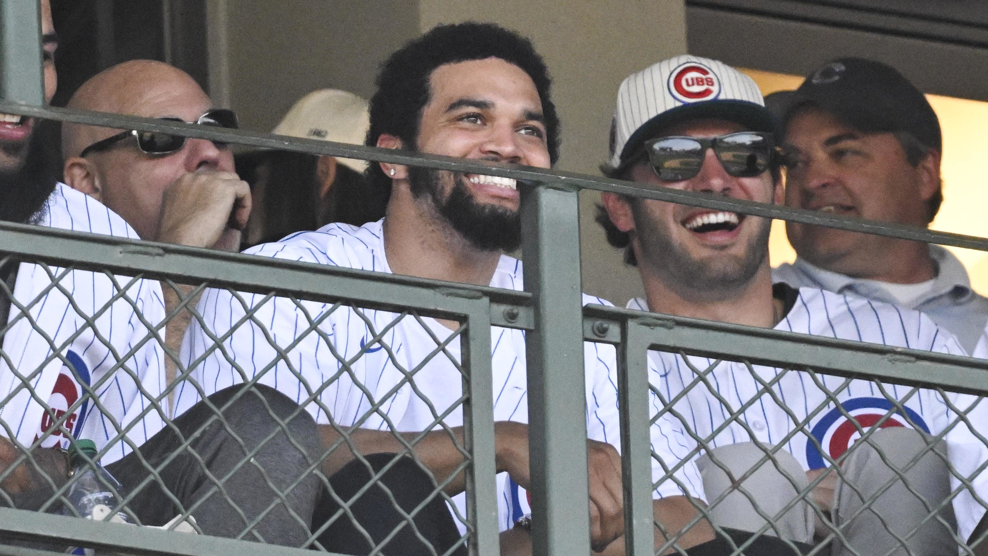 Caleb William,  Cole Kmet, several other teammates and Bears officials took in Saturday's Cubs win over the Brewers.