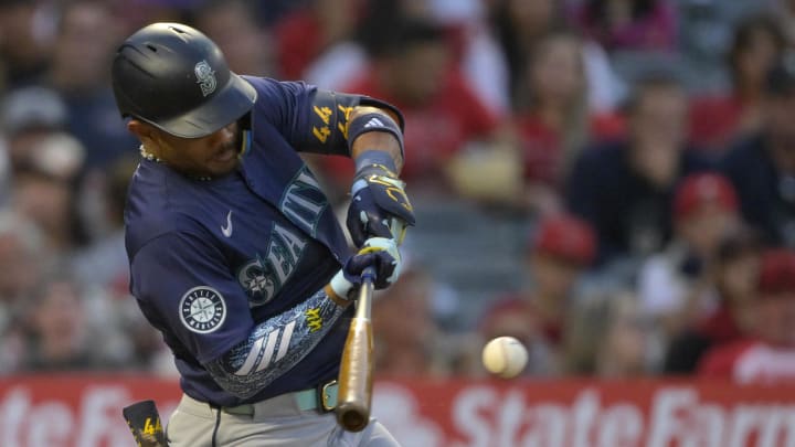 Seattle Mariners center fielder Julio Rodriguez singles in the fifth inning against the Los Angeles Angels on Saturday at Angel Stadium.