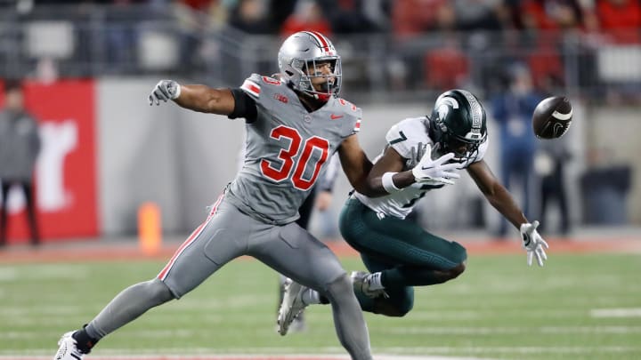 Nov 11, 2023; Columbus, Ohio, USA; Ohio State Buckeyes linebacker Cody Simon (30) breaks up the pass intended for Michigan State Spartans wide receiver Antonio Gates Jr. (7) during the third quarter at Ohio Stadium. Mandatory Credit: Joseph Maiorana-USA TODAY Sports