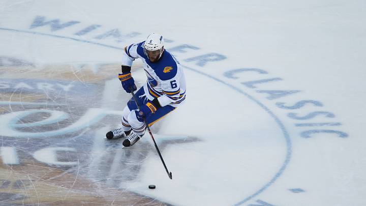 Jan 1, 2018; Queens, NY, USA; Buffalo Sabres defenseman Marco Scandella (6) with the puck against the New York Rangers during the second period in the 2018 Winter Classic hockey game at Citi Field. Mandatory Credit: Danny Wild-USA TODAY Sports