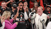 Oct 18, 2023; Brooklyn, New York, USA; Las Vegas Aces forward A'ja Wilson (22) and owner Mark Davis celebrate after winning the 2023 WNBA Finals at Barclays Center.