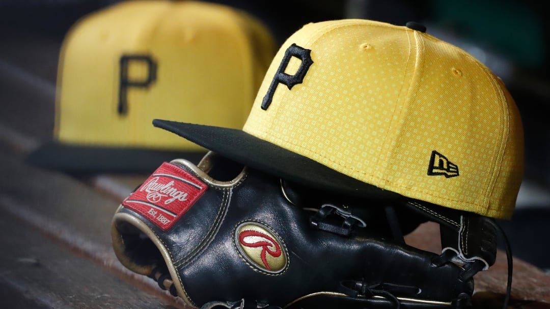 Sep 16, 2023; Pittsburgh, Pennsylvania, USA;  Pittsburgh Pirates hats and gloves in the dugout against the New York Yankees during the sixth inning at PNC Park. Mandatory Credit: Charles LeClaire-USA TODAY Sports