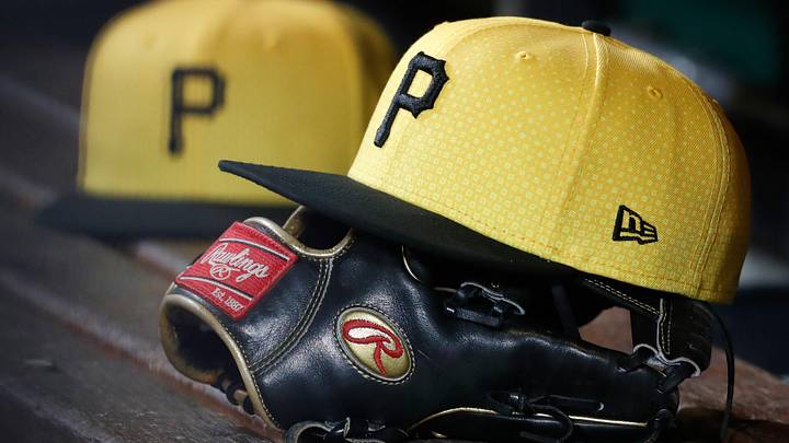 Sep 16, 2023; Pittsburgh, Pennsylvania, USA;  Pittsburgh Pirates hats and gloves in the dugout against the New York Yankees during the sixth inning at PNC Park. Mandatory Credit: Charles LeClaire-Imagn Images