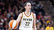 Jul 9, 2025; Indianapolis, Indiana, USA; Indiana Fever guard Caitlin Clark (22) dibbles in the first half against Golden State Valkyries at Gainbridge Fieldhouse. Mandatory Credit: Trevor Ruszkowski-Imagn Images
