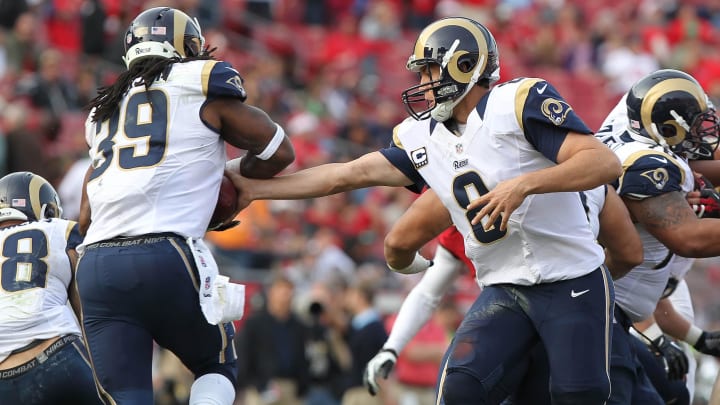 December 23, 2012; Tampa, FL, USA;  St. Louis Rams quarterback Sam Bradford (8) hands the ball off to running back Steven Jackson (39) during the second half against the Tampa Bay Buccaneers at Raymond James Stadium. St. Louis Rams defeated the Tampa Bay Buccaneers 28-13. Mandatory Credit: Kim Klement-USA TODAY Sports
