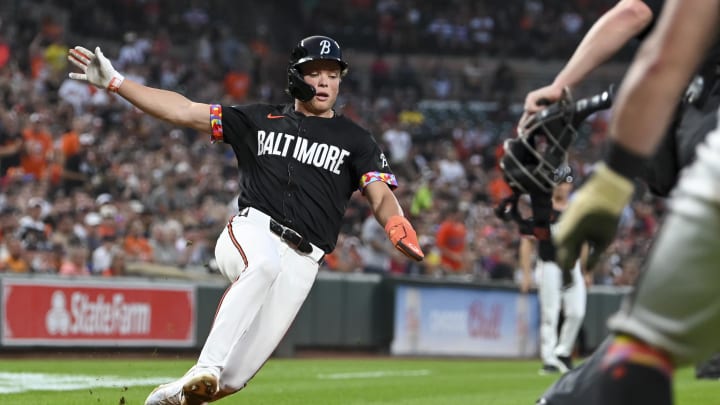 Aug 16, 2024; Baltimore, Maryland, USA;  Baltimore Orioles second baseman Jackson Holliday (7) slides to score on third baseman Ramon Urias (not pictured) rbi single against the Boston Red Sox at Oriole Park at Camden Yards. 