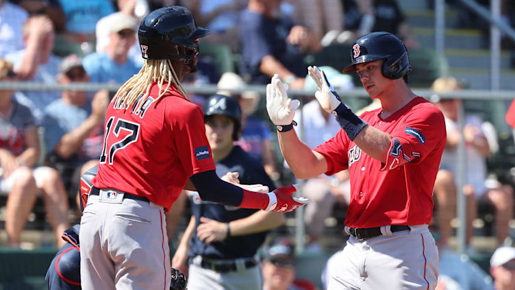 Feb 25, 2023; North Port, Florida, USA;  Boston Red Sox first baseman Bobby Dalbec, right, is