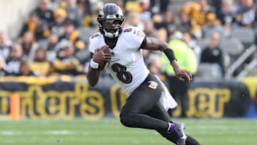 Nov 17, 2024; Pittsburgh, Pennsylvania, USA;  Baltimore Ravens quarterback Lamar Jackson (8) runs the ball against the Pittsburgh Steelers during the first quarter at Acrisure Stadium. Mandatory Credit: Charles LeClaire-Imagn Images