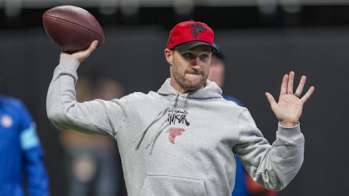 Atlanta Falcons quarterback Kirk Cousins warms up before a game. Atlanta Falcons quarterback Kirk Cousins warms up before a game.