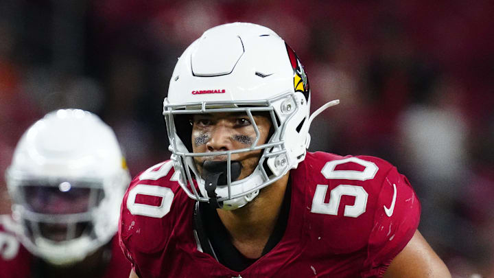 Cardinals linebacker Cody Simon (50) looks at the Chiefs quarterback Chris Oladokun (19) as he snaps the ball during a preseason game at State Farm Stadium on Aug. 9, 2025, in Glendale. Cardinals linebacker Cody Simon (50) looks at the Chiefs quarterback Chris Oladokun (19) as he snaps the ball during a preseason game at State Farm Stadium on Aug. 9, 2025, in Glendale.