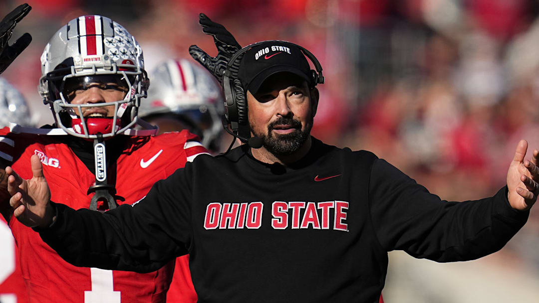 Ohio State Buckeyes head coach Ryan Day and wide receiver Brandon Inniss (1) react during the second half of the NCAA football game against the Rutgers Scarlet Knights at Ohio Stadium in Columbus on Nov. 22, 2025. Ohio State won 42-9.