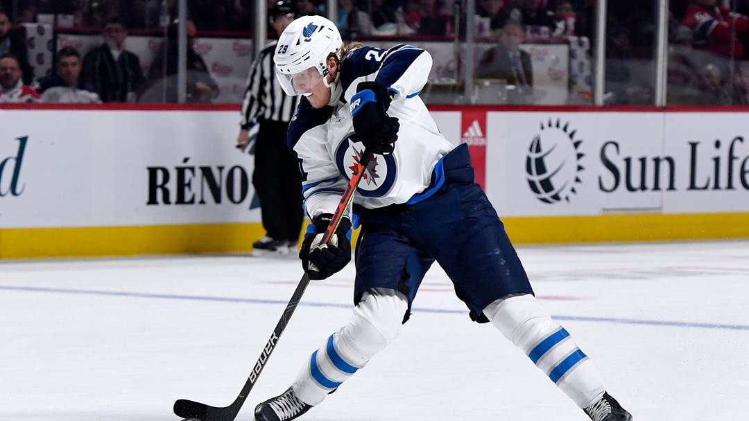 Winnipeg Jets forward Patrick Laine (29) shoots the puck during the third period of the game against the Montreal Canadiens at the Bell Centre. Mandatory Credit: Eric Bolte-USA TODAY Sports Winnipeg Jets forward Patrick Laine (29) shoots the puck during the third period of the game against the Montreal Canadiens at the Bell Centre. Mandatory Credit: Eric Bolte-USA TODAY Sports