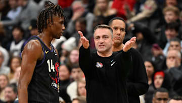 Jan 21, 2025; Toronto, Ontario, CAN;  Toronto Raptors head coach Darko Rajakovic speaks with guard Ja'Kobe Walter (14) as assistant coach Jama Mahlalela looks on in the second half against the Orlando Magic at Scotiabank Arena. Mandatory Credit: Dan Hamilton-Imagn Images