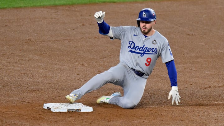 Los Angeles Dodgers second baseman Gavin Lux slides into second with a double during the second inning against the New York Yankees.