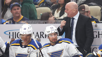 Mar 13, 2025; Pittsburgh, Pennsylvania, USA; St. Louis Blues head coach Jim Montgomery (right) gestures on the bench against the Pittsburgh Penguins during the third period at PPG Paints Arena. Mandatory Credit: Charles LeClaire-Imagn Images