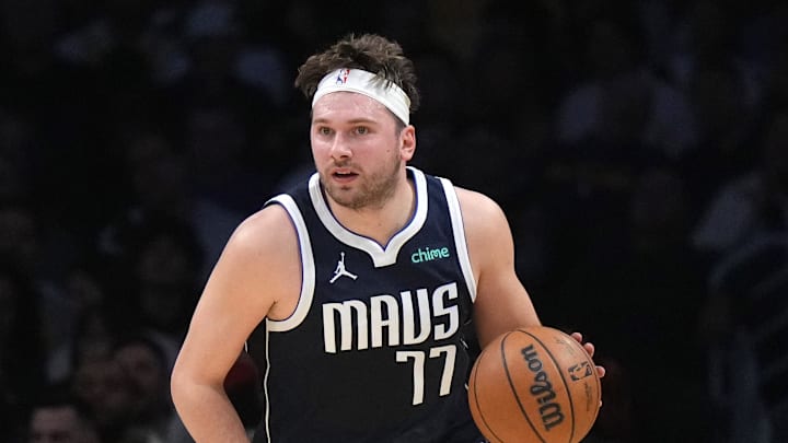 Jan 17, 2024; Los Angeles, California, USA; Dallas Mavericks guard Luka Doncic (77) dribbles the ball against the Los Angeles Lakers in the first half at Crypto.com Arena. Mandatory Credit: Kirby Lee-Imagn Images