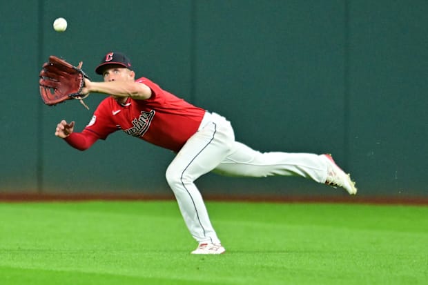 Myles Straw catches a ball 