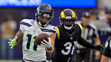 Nov 16, 2025; Inglewood, California, USA; Seattle Seahawks wide receiver Jaxon Smith-Njigba (11) makes a one handed catch against Los Angeles Rams cornerback Darious Williams (31) during the first half at SoFi Stadium. Mandatory Credit: Jayne Kamin-Oncea-Imagn Images