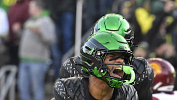 Nov 22, 2025; Eugene, Oregon, USA; Oregon Ducks tight end Kenyon Sadiq (18) celebrates against the Southern California Trojans during the second half at Autzen Stadium. Mandatory Credit: Troy Wayrynen-Imagn Images
