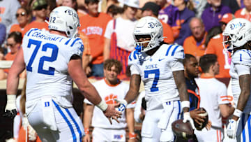 Duke Blue Devils wide receiver Que'Sean Brown (7) celebrates with Duke Blue Devils offensive lineman Matt Craycraft (72) and Duke Blue Devils safety Terry Moore (1) after scoring a touchdown Saturday, Nov. 1, 2025, during the NCAA football game at Memorial Stadium in Clemson, South Carolina.