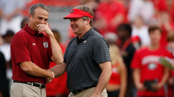 Sep 18, 2021; Athens, Georgia, USA; Georgia Bulldogs coach Kirby Smart (right) and South Carolina Gamecocks head coach Shane Beamer (left) speak before kickoff at Sanford Stadium. Mandatory Credit: Joshua L. Jones/Athens Banner-Herald via USA TODAY NETWORK

Ncaa Football South Carolina At Georgia