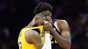 Nov 27, 2023; Philadelphia, Pennsylvania, USA: Philadelphia 76ers center Joel Embiid (21) talks with Los Angeles Lakers forward LeBron James (23) during the second quarter at Wells Fargo Center. Mandatory Credit: Bill Streicher-Imagn Images