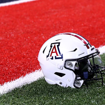 Sep 2, 2023; Tucson, Arizona, USA; Arizona Wildcats quarterback Jayden de Laura (7) helmet on the field after a victory over Northern Arizona Lumberjacks at Arizona Stadium. Mandatory Credit: Zac BonDurant-Imagn Images