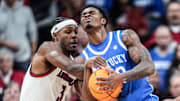 Louisville Cardinals guard Ryan Conwell (3) tussles with Kentucky Wildcats guard Otega Oweh (00) for control in the first half during the UofL-UK annual rivalry game at the KFC Yum! Center in Louisville, Kentucky Nov. 11, 2025.