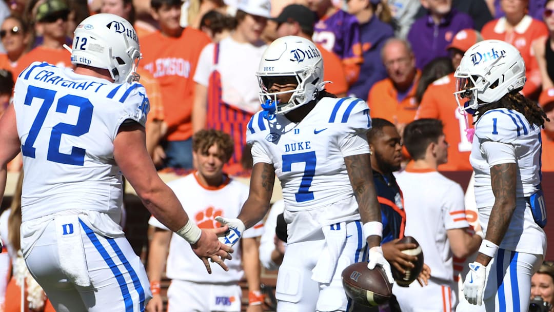 Duke Blue Devils wide receiver Que'Sean Brown (7) celebrates with Duke Blue Devils offensive lineman Matt Craycraft (72) and Duke Blue Devils safety Terry Moore (1) after scoring a touchdown Saturday, Nov. 1, 2025, during the NCAA football game at Memorial Stadium in Clemson, South Carolina.