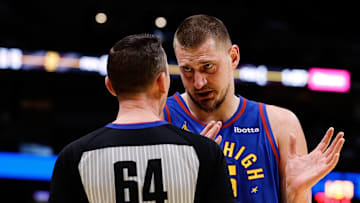 Dec 3, 2024; Denver, Colorado, USA; Denver Nuggets center Nikola Jokic (15) talks with referee Justin Van Duyne (64) in the second quarter against the Golden State Warriors at Ball Arena.