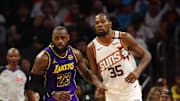 Oct 28, 2024; Phoenix, Arizona, USA; Los Angeles Lakers forward LeBron James (23) against Phoenix Suns forward Kevin Durant (35) at Footprint Center. Mandatory Credit: Mark J. Rebilas-Imagn Images