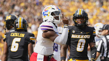 Sep 6, 2025; Columbia, Missouri, USA; Kansas Jayhawks quarterback Jalon Daniels (6) celebrates after scoring a touchdown during the first half against the Missouri Tigers  at Faurot Field at Memorial Stadium. Mandatory Credit: Jay Biggerstaff-Imagn Images
