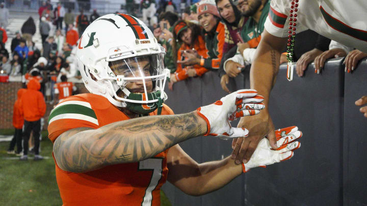 Nov 12, 2022; Atlanta, Georgia, USA; Miami Hurricanes wide receiver Xavier Restrepo (7) celebrates with fans after a victory against the Georgia Tech Yellow Jackets at Bobby Dodd Stadium. Mandatory Credit: Brett Davis-USA TODAY Sports