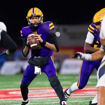 Roman Catholic's Semaj Beals looks to pass from the pocket during the PIAA Class 5A football championship game against Bishop McDevitt at Cumberland Valley High School, Friday, Dec. 5, 2025, in Mechanicsburg, Pa.