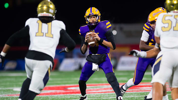 Roman Catholic's Semaj Beals looks to pass from the pocket during the PIAA Class 5A football championship game against Bishop McDevitt at Cumberland Valley High School, Friday, Dec. 5, 2025, in Mechanicsburg, Pa.