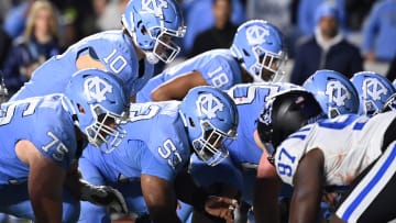 Nov 11, 2023; Chapel Hill, North Carolina, USA; North Carolina Tar Heels quarterback Drake Maye (10) at the line of scrimmage in the fourth quarter at Kenan Memorial Stadium. Mandatory Credit: Bob Donnan-USA TODAY Sports