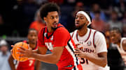 Mississippi forward Jaemyn Brakefield (4) looks for an opening past Auburn forward Chaney Johnson (31) during the second half of a Southeastern Conference tournament quarterfinal game at Bridgestone Arena in Nashville, Tenn., Friday, March 14, 2025.